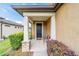 Covered front porch with stone accents and a black door at 9661 Sw 63Rd Loop, Ocala, FL 34481