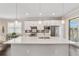 Large kitchen island with white quartz countertop at 9661 Sw 63Rd Loop, Ocala, FL 34481