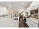 Modern kitchen featuring a large island, stainless steel appliances, and white cabinets at 9661 Sw 63Rd Loop, Ocala, FL 34481