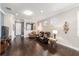 Bright living room with hardwood floors, comfortable seating, and accent wall at 9661 Sw 63Rd Loop, Ocala, FL 34481