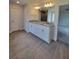 Double vanity bathroom with granite countertop and white cabinets at 9727 Sw 125Th Court Rd, Dunnellon, FL 34432