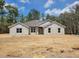 New construction home featuring a block exterior and a classic roof design ready for finishing touches at 12295 Sw 90Th Pl, Dunnellon, FL 34432
