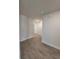 Hallway with hardwood flooring and white doors at 12295 Sw 90Th Pl, Dunnellon, FL 34432