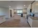 Modern kitchen with white cabinets, granite countertops, an island, and stainless steel appliances at 12295 Sw 90Th Pl, Dunnellon, FL 34432