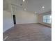 Bright living room featuring vaulted ceilings, recessed lighting, and wood-look tile flooring at 12295 Sw 90Th Pl, Dunnellon, FL 34432