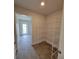 Walk-in pantry with wire shelving for organized storage, and tile flooring with natural light at 12295 Sw 90Th Pl, Dunnellon, FL 34432