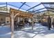 Spacious backyard patio with covered seating area, hot tub, and gazebo at 12750 Se 119Th Ct, Ocklawaha, FL 32179