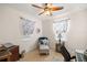 Cozy bedroom with a comfy armchair and natural light at 12750 Se 119Th Ct, Ocklawaha, FL 32179
