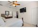 Serene bedroom with a comfortable bed and access to a bathroom at 12750 Se 119Th Ct, Ocklawaha, FL 32179
