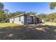 Side view of house with landscaping and shed at 12750 Se 119Th Ct, Ocklawaha, FL 32179