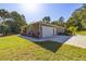 Attached garage with landscaping and driveway at 12750 Se 119Th Ct, Ocklawaha, FL 32179
