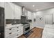 Modern kitchen with stainless steel appliances and white shaker cabinets at 12750 Se 119Th Ct, Ocklawaha, FL 32179