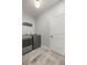 Convenient laundry room with washer and dryer and extra storage at 12750 Se 119Th Ct, Ocklawaha, FL 32179