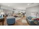 Open living room with hardwood floors and ample natural light at 12750 Se 119Th Ct, Ocklawaha, FL 32179