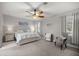 Spacious main bedroom with ceiling fan and plenty of natural light at 12750 Se 119Th Ct, Ocklawaha, FL 32179