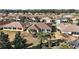 Aerial perspective of a house with backyard and neighborhood view at 13077 Se 86 Ct, Summerfield, FL 34491
