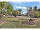 Landscaped backyard with tropical plants at 13077 Se 86 Ct, Summerfield, FL 34491