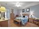 Main bedroom with wood flooring and comfortable seating at 13077 Se 86 Ct, Summerfield, FL 34491