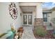 Elegant front entry with double doors, stone accents, and a walkway at 13077 Se 86 Ct, Summerfield, FL 34491