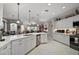 Open concept kitchen with island and breakfast bar at 13077 Se 86 Ct, Summerfield, FL 34491