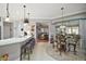 Open kitchen with island, breakfast nook, and view to living area at 13077 Se 86 Ct, Summerfield, FL 34491