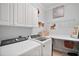 Laundry room with Whirlpool appliances and ample storage at 13077 Se 86 Ct, Summerfield, FL 34491