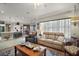 Open living room, kitchen view, and comfortable seating at 13077 Se 86 Ct, Summerfield, FL 34491