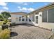 Brick paved patio adjacent to the house at 13077 Se 86 Ct, Summerfield, FL 34491