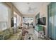 Sunroom with seating area and large windows at 13077 Se 86 Ct, Summerfield, FL 34491