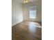 Bright bedroom with laminate flooring and window blinds at 13410 Sw 3Rd Ct, Ocala, FL 34473