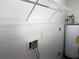 Laundry room with shelving and water heater at 13410 Sw 3Rd Ct, Ocala, FL 34473