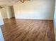 Large living room featuring laminate wood flooring and ceiling fan at 13410 Sw 3Rd Ct, Ocala, FL 34473