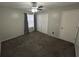 Bright bedroom featuring carpet, window, and double doors at 1701 Se 24Th Rd # 201, Ocala, FL 34471