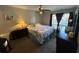 Bedroom with carpeted floors, a queen-size bed, and ceiling fan at 1701 Se 24Th Rd # 201, Ocala, FL 34471