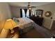 Bedroom with carpeted floors, a king-size bed, and ceiling fan at 1701 Se 24Th Rd # 201, Ocala, FL 34471