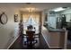 Dining room with dark hardwood floors and kitchen view at 1701 Se 24Th Rd # 201, Ocala, FL 34471