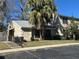 Tan house with palm trees, steps, and parking at 1701 Se 24Th Rd # 201, Ocala, FL 34471