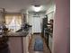 Galley kitchen with dark countertops and stainless steel appliances at 1701 Se 24Th Rd # 201, Ocala, FL 34471