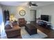 Living room with dark hardwood floors and leather furniture at 1701 Se 24Th Rd # 201, Ocala, FL 34471
