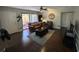 Living room with dark hardwood floors, leather furniture, and patio access at 1701 Se 24Th Rd # 201, Ocala, FL 34471