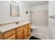 Clean bathroom with a wood vanity and shower/tub at 21202 Sandalwood Dr # 21-202, Wildwood, FL 34785