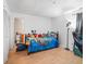 Bright bedroom with wood floors and plenty of space at 21202 Sandalwood Dr # 21-202, Wildwood, FL 34785
