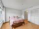 Bedroom with wood floors and built-in closet at 21202 Sandalwood Dr # 21-202, Wildwood, FL 34785