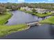 Lakefront property with a charming footbridge at 21202 Sandalwood Dr # 21-202, Wildwood, FL 34785