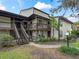 Two-story townhouse building with stairs and landscaping at 21202 Sandalwood Dr # 21-202, Wildwood, FL 34785
