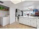 Kitchen with island and view into living room at 21202 Sandalwood Dr # 21-202, Wildwood, FL 34785