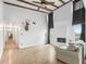 Living room with high ceilings, exposed beams, and fireplace at 21202 Sandalwood Dr # 21-202, Wildwood, FL 34785
