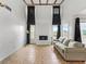 Living room with a fireplace and high ceilings at 21202 Sandalwood Dr # 21-202, Wildwood, FL 34785