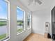Sunroom with water views and new flooring at 21202 Sandalwood Dr # 21-202, Wildwood, FL 34785