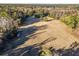 Aerial view of large pasture with surrounding trees at 2821 Se 80Th St, Ocala, FL 34480